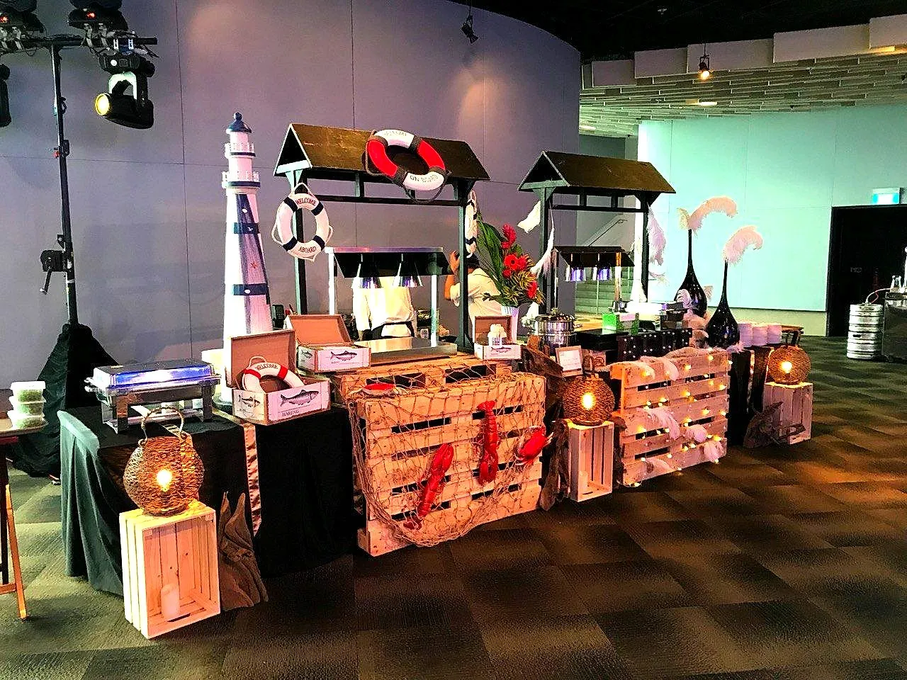 Rustic crate-and-lantern buffet station with a nautical theme
